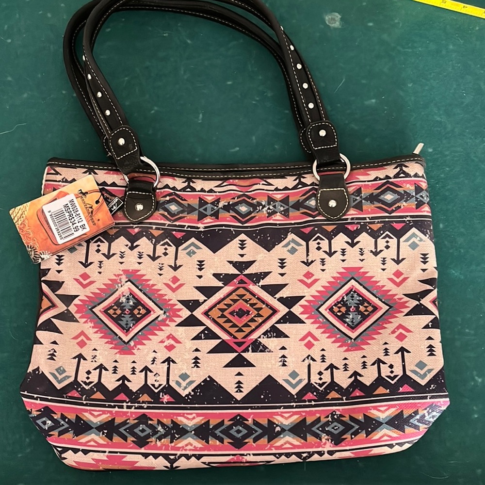 Montana west big purse This bag is priced as low as I can, so price is FIRM!